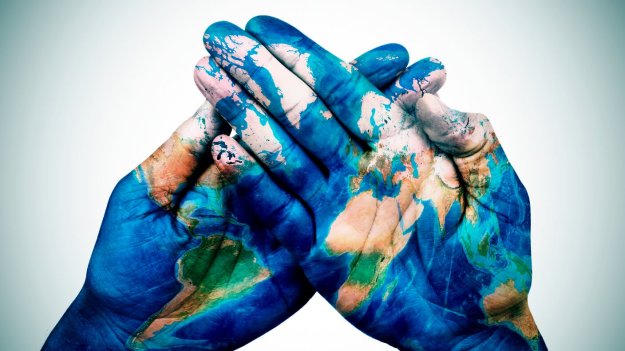 050887590-man-hands-patterned-world-map-